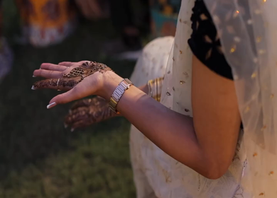 A Shot of Indian Bride showing Mehndi in her Hands at her Indian Wedding in New Delhi, India