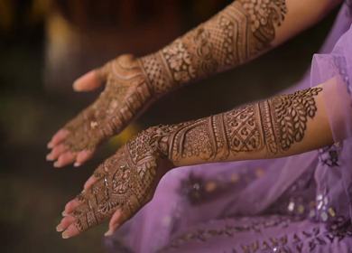 A Shot of Indian Bride showing Mehndi in her Hands at her Indian Wedding in New Delhi, India