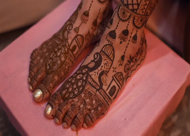 A Shot of Indian Bride showing Mehndi on her feet at her Indian Wedding in New Delhi, India