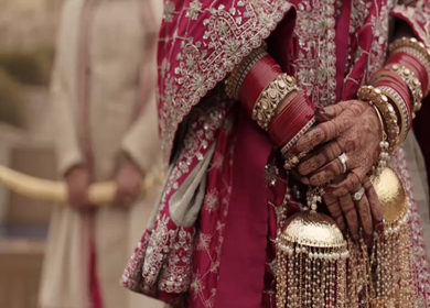 A Slow motion shot of a Indian Groom and Indian Bride posing towards camera at their Indian wedding in India