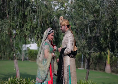 A Slow motion shot of an Indian Groom and Indian Bride posing towards camera at their Indian wedding in India