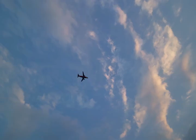 A shot of Airplane Flying Over Visakhapatnam Coastline at Dusk India