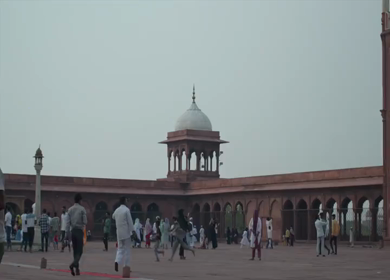 A shot of People walking and gathering in the courtyard of Jama Masjid, Delhi in India