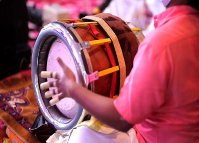 Shot of a man playing dholak at Indian Wedding Function at New Delhi, India