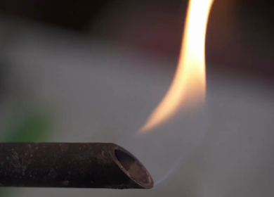 A static mid shot of a burner with flames coming out of it in India