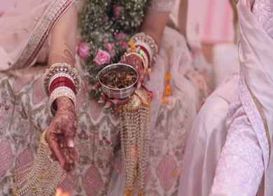 Shot of an Indian Bride and Indian Groom doing Puja,traditions at their Indian wedding in New Delhi, India
