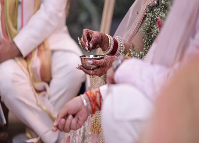 Shot of an Indian Bride and Indian Groom doing Puja,traditions at their Indian wedding in New Delhi, India