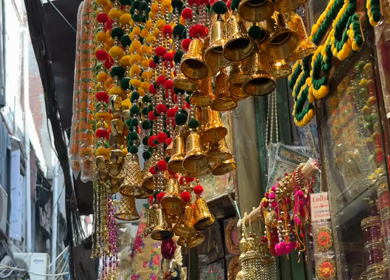 A Slow Motion shot of Colorful Flower Garlands Hanging at Market Shop in Delhi India