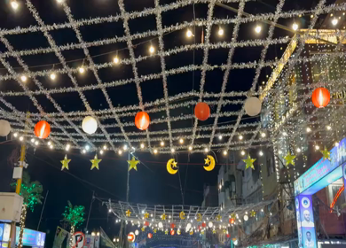 18th march 2026 : Crowd at Jama Masjid Market During Ramadan Night with festive lights decoration in Delhi India