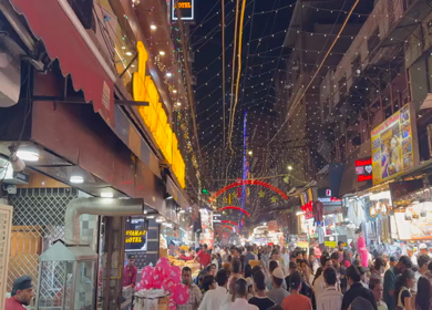 18th march 2026 : Crowd at Jama Masjid Market During Ramadan Night with festive lights decoration in Delhi India