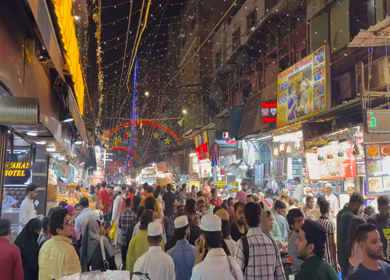 18th march 2026 : Crowd at Jama Masjid Market During Ramadan Night with festive lights decoration in Delhi India