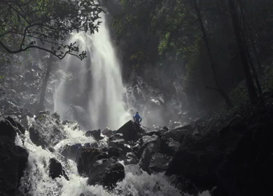 Drone shot of a person tourist Near Waterfall in Karnataka India