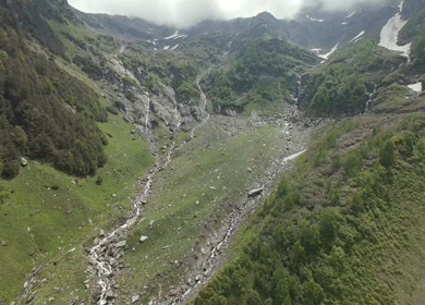 FPV Aerial View of Mountain Valley and Snow Patch in Ladakh, India