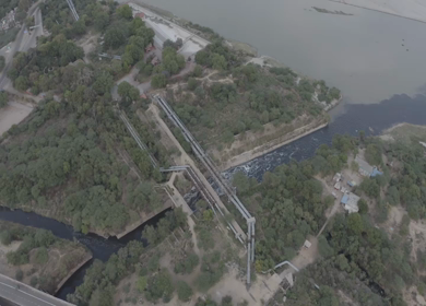 An aerial shot of water flowing past the Karnal bypass in New Delhi, India