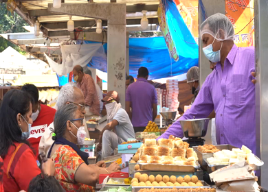 A shot of people buying sweets at New Delhi, India