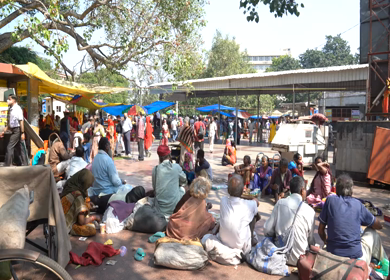 A static shot of Beggars outside Hanuman Mandir at New Delhi, India