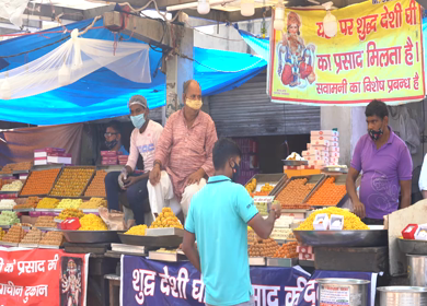 A static shot people buying sweets from a sweets shop 