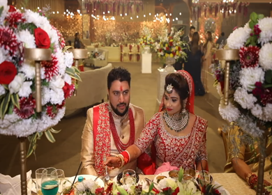 9th February,2019: A Shot of Newly-Wed Indian Couple enjoying and having food at their Indian Wedding in New Delhi, India