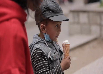 A shot of a kid enjoying eating icecream at Leh Ladakh,India
