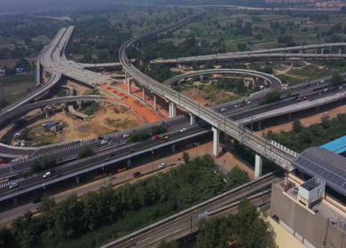 An aerial shot of the Two Delhi Metro Trains crossing each other at Mayur Vihar,New Delhi, India