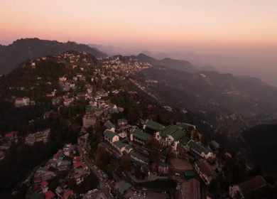 An aerial shot of Queen of the Hills which is Mussorrie being surrounded by Greenery and Sky