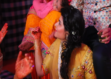 New Delhi,NCR,India-7th February,2019: Shot of an Indian girl clapping on a song at her brothers Big Fat Indian wedding mehendi function in New Delhi, India