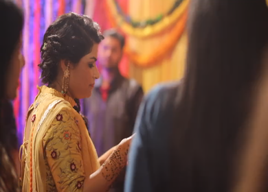 New Delhi,NCR,India-7th February,2019: Shot of an Indian girl feeding her friend with Panipuri at her brothers Big Fat Indian wedding mehendi function in New Delhi, India