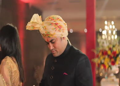 New Delhi,NCR,India-9th February,2019: An Indian man surfing his phone at an Indian wedding in New Delhi,India