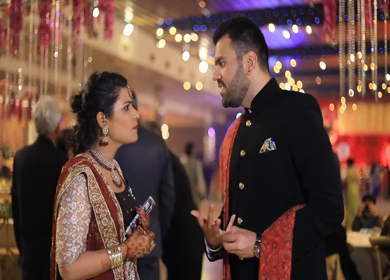 New Delhi,NCR,India-9th February,2019: An Indian Couple chatting at an Indian wedding in New Delhi,India