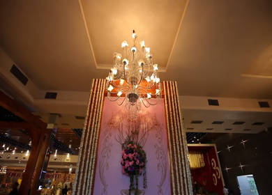 New Delhi,NCR,India-9th February,2019: A steady cam shot of a traditional floral decore and a chandelier at a Big Fat Indian wedding function in New Delhi, India