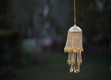 A Slow motion shot of a traditional kalira revolving at an Indian Wedding in New Delhi,India