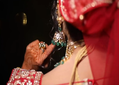 A Slow motion shot of a beautiful Indian Bride playing with her earring