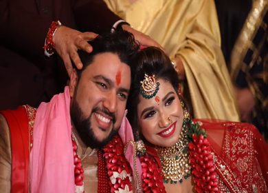 New Delhi,NCR,India-9th February,2019: Shot of a Indian Groom and Bride posing towards camera while their heads are joined at their Indian wedding in New Delhi,India