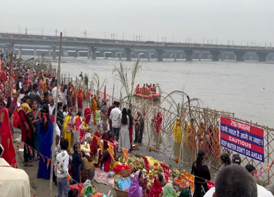 26th October 2025 : A shot of People Performing Chhath Puja Ritual at Yamuna River Kalindi Kunj Delhi India