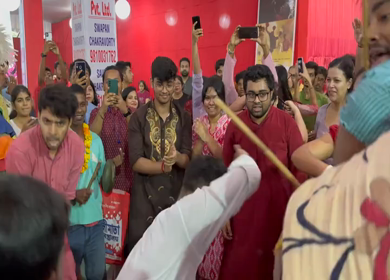 28th September 2025 : A Shot of People Performing Traditional Dance at Durga Puja Pandal Delhi India