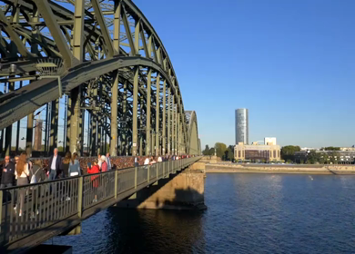 20th March 2026 : A People Walking on Hohenzollern Bridge Over Rhine River in Cologne Germany