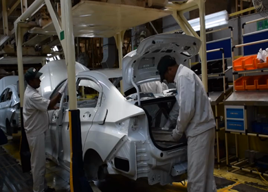 Greater Noida, CIRCA April 2017: Logos being fixed in the car at car manufacturing plant in India