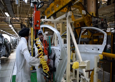 Greater Noida, CIRCA April 2017: Car doors being detached at car manufacturing plant in India