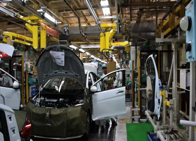 Greater Noida, CIRCA April 2017:  shot of fixing doors to the car at a car factory in india