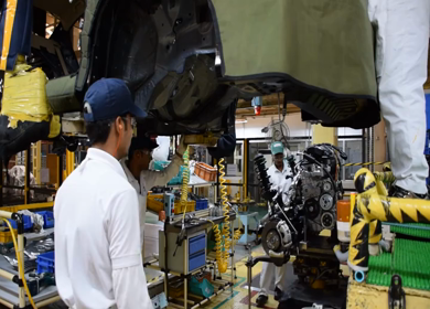Greater Noida, CIRCA April 2017: engine being fixed in a car at car manufacturing plant in India