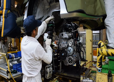 Greater Noida, CIRCA April 2017: engine being fixed in a car at a car factory in india