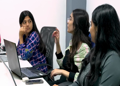 A shot of Indian colleagues having a casual conversation in their office conference room 