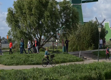 20th March 2026 : Slow Motion Tourists Walking Near Traditional Dutch Houses in Amsterdam