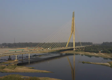 An aerial pan shot of the Signature Bridge in New Delhi, India