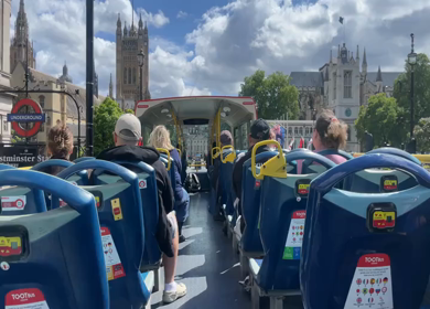 15th June 2024 : Tourists riding open top sightseeing tootbus near Westminster in London England