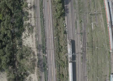 An aerial shot of the Indian Railways Train moving on railway tracks 