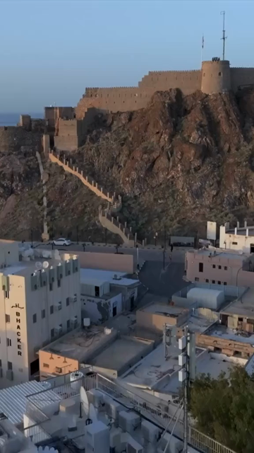 Vertical Aerial Evening View of Al Jalali Fort Old Muscat Oman