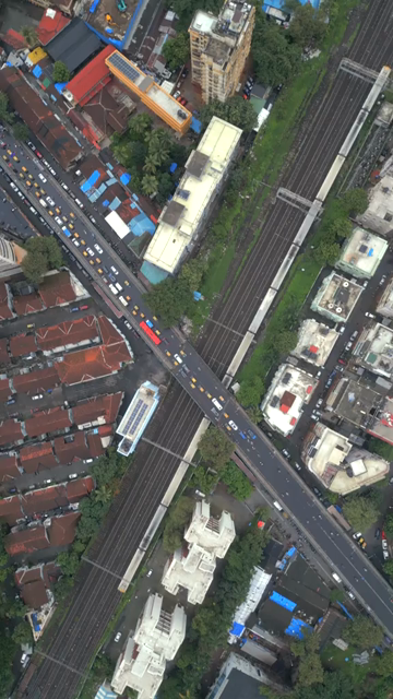 Vertical Aerial Evening View of Dadar Railway Station and Mumbai Cityscape