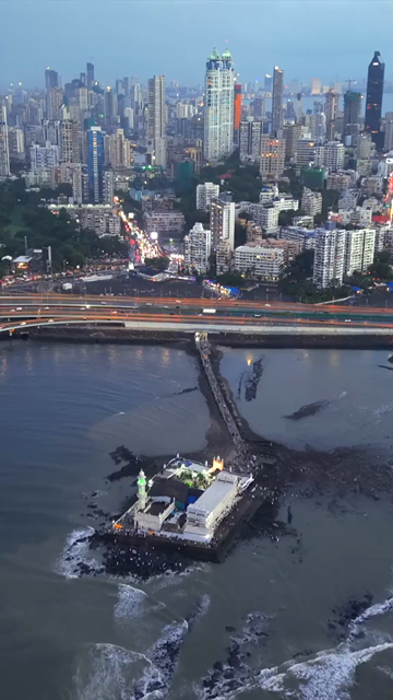 Vertical Aerial Evening View of Mumbai Coastal Road Haji Ali Dargah and Mumbai Skyline Maharashtra