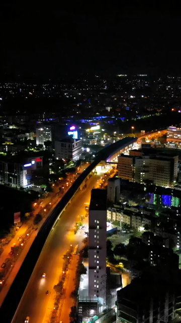 Vertical Aerial Night View of Kolkata City and Urban Infrastructure, India